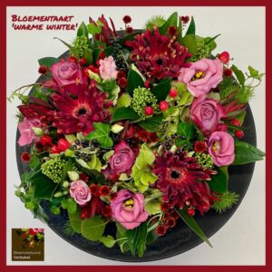 bloementaart "warme winter" , gerbera, roos ,eustoma, skimmia, groensoorten en onderbord